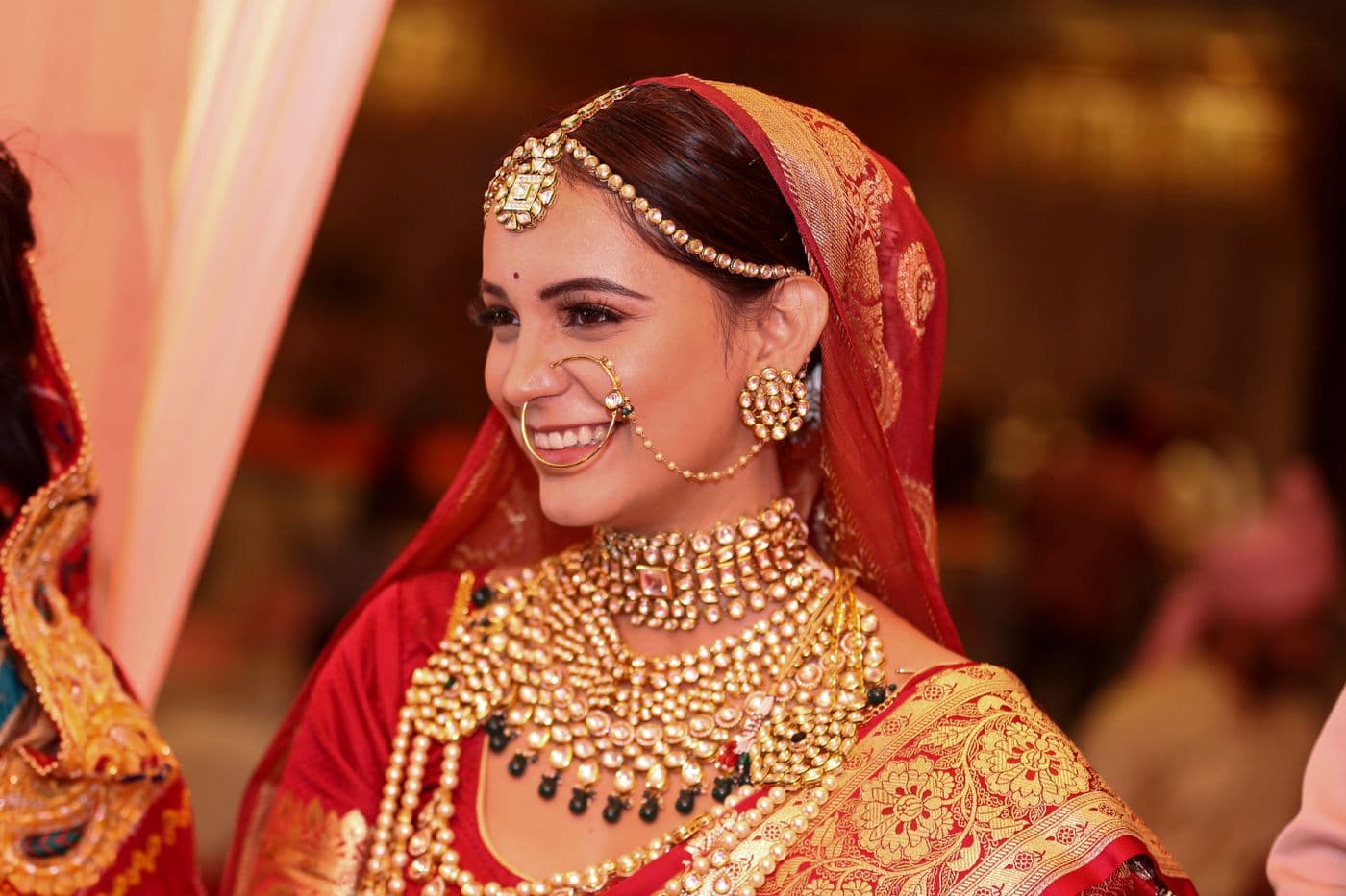 Bride in ornate traditional attire photographed during a ceremony