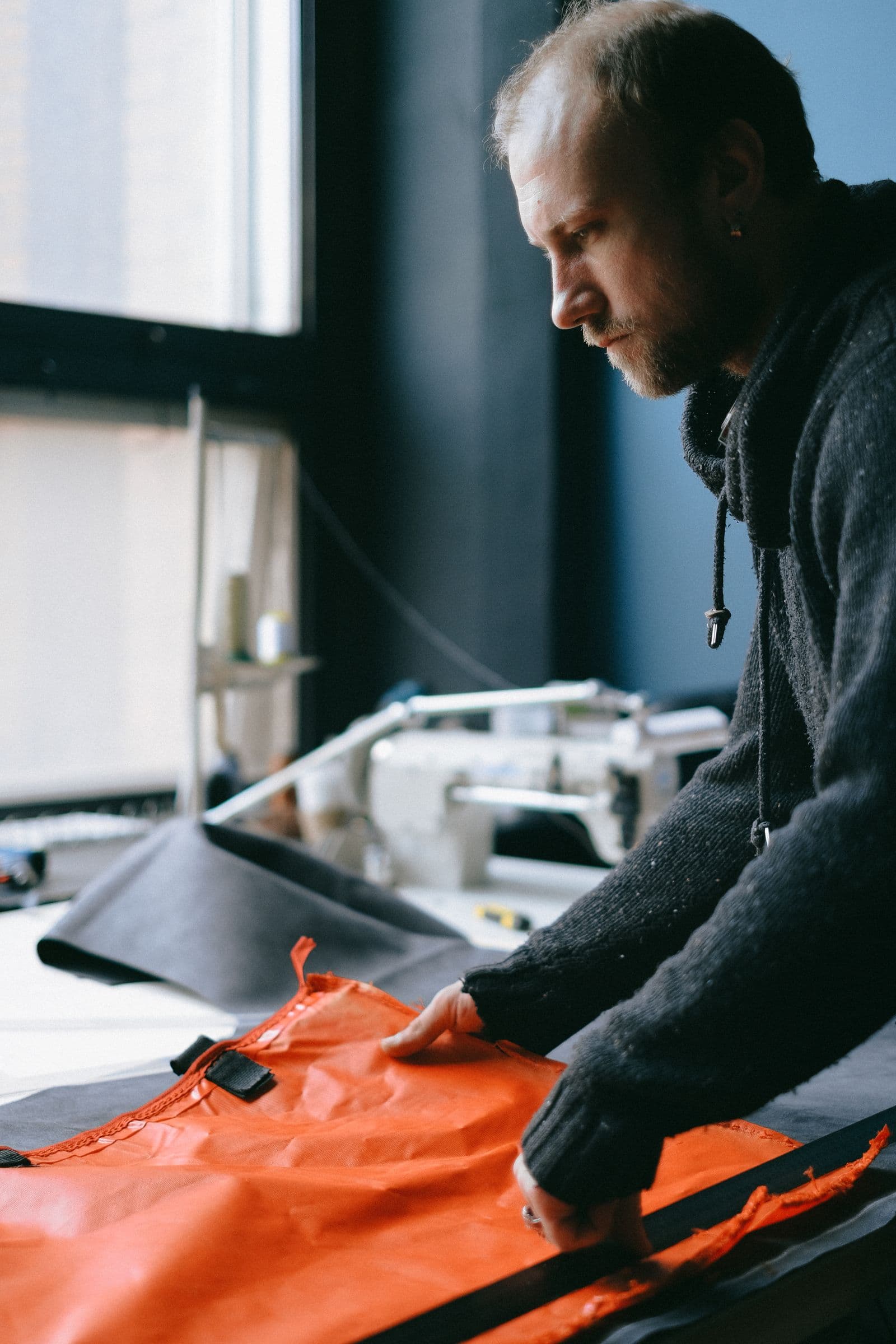 Designer working on a garment in the ONERA studio