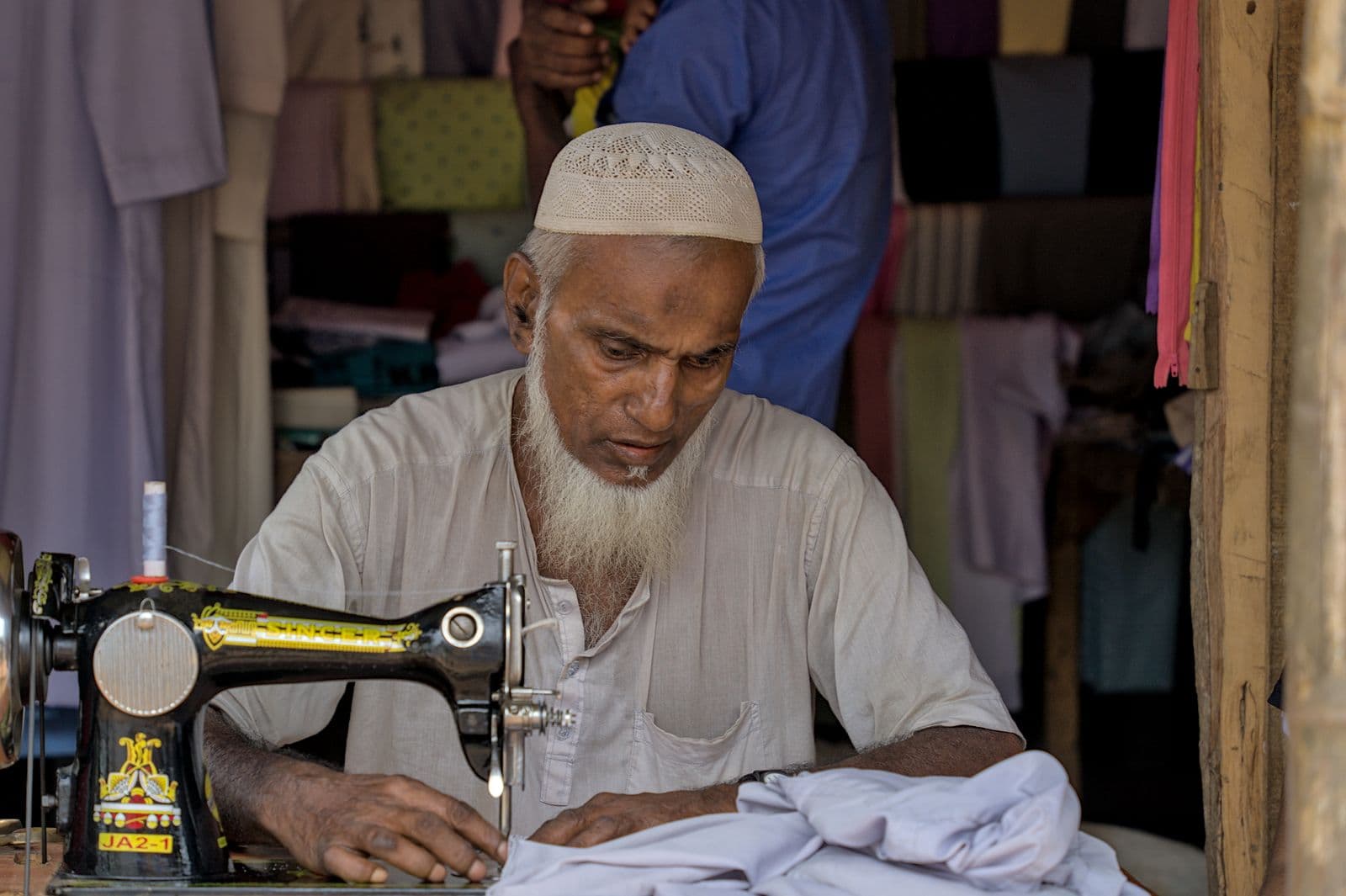 Master tailor at work in a traditional workshop