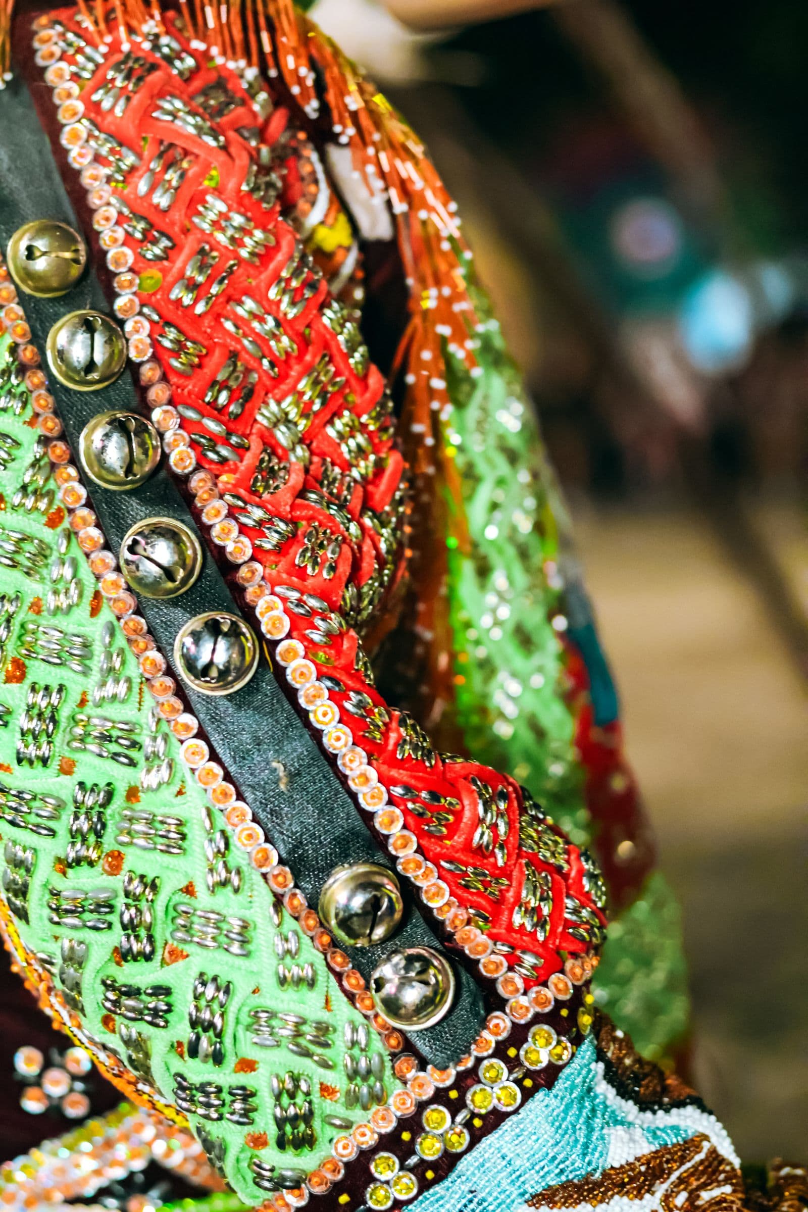 Colourful traditional embroidery with metal embellishments