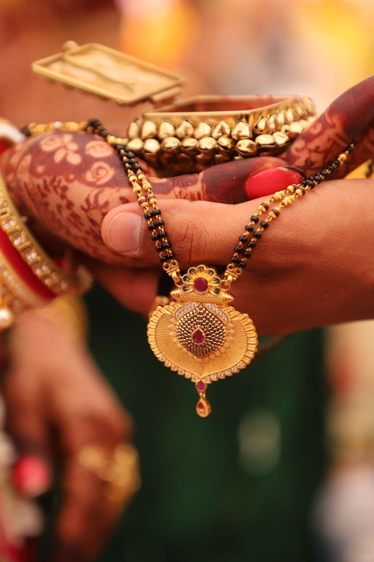 Gold jewellery being exchanged during a wedding ceremony