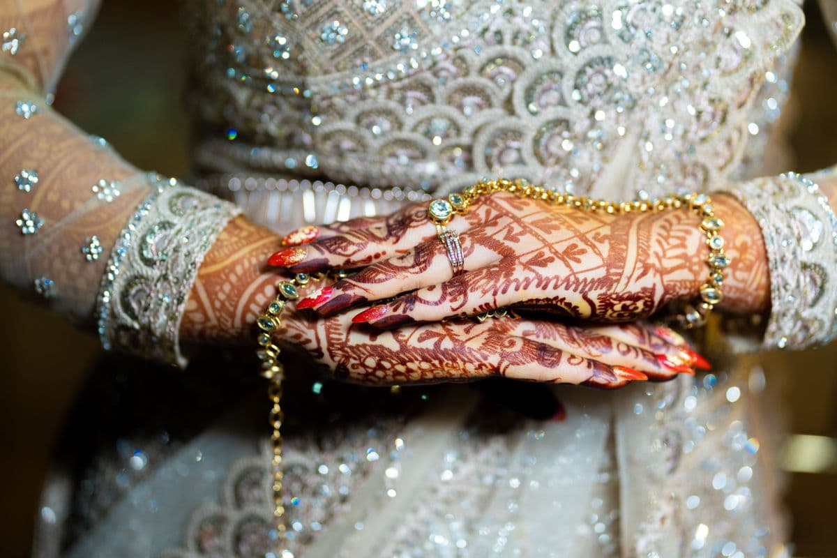 Bride's hands adorned with intricate mehndi