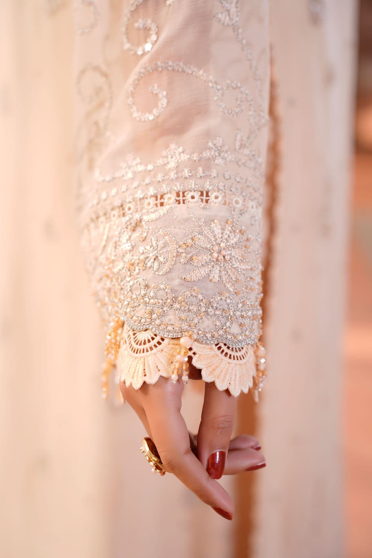 Close-up of an intricately embroidered dress sleeve