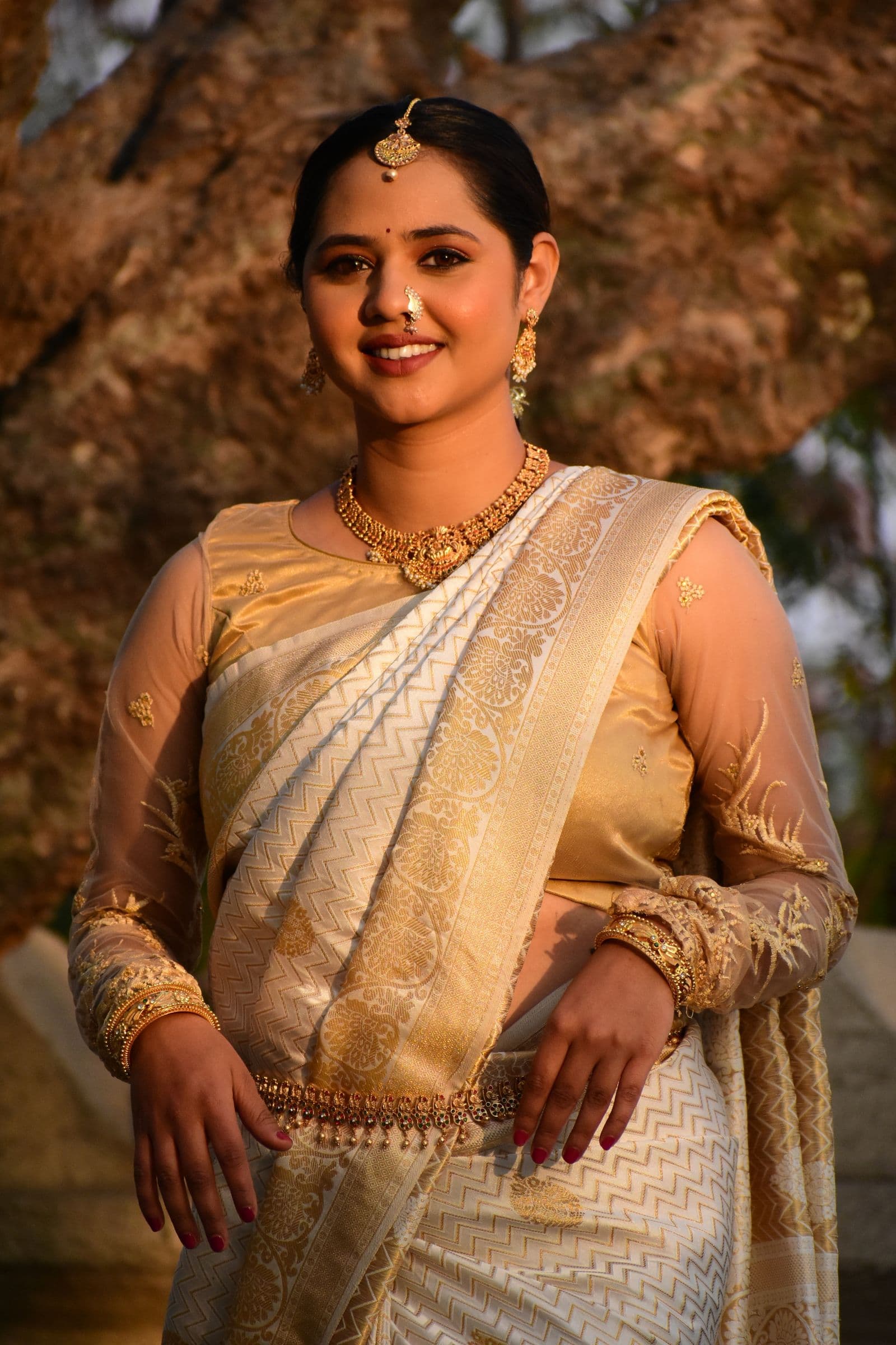 Woman in a hand-woven silk saree, photographed in soft light