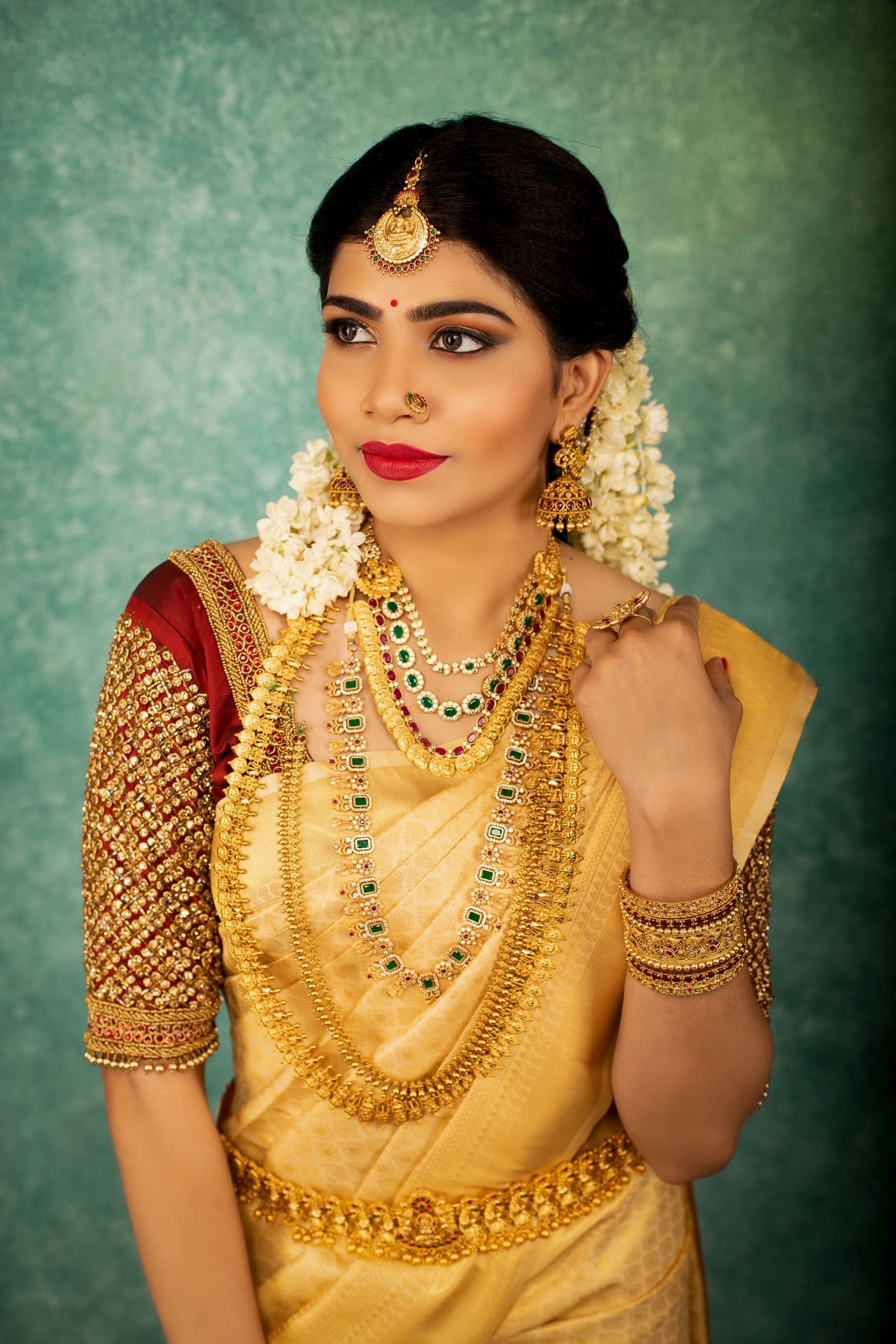 Bride in yellow and gold with traditional jewellery